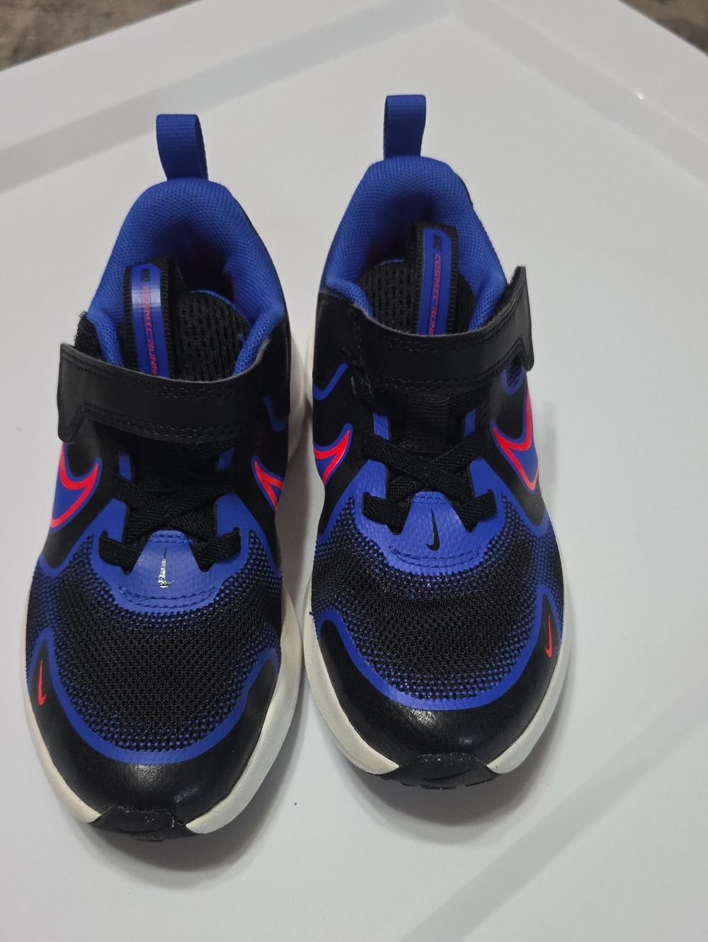 Nike Kids Black and Blue Sneaker with Red Swoosh